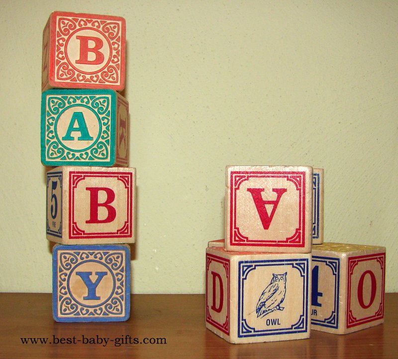 wooden baby blocks, printed in old fashioned style, showing letters and animals, some spelling "baby"
