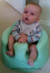 baby boy in a bamboo chair