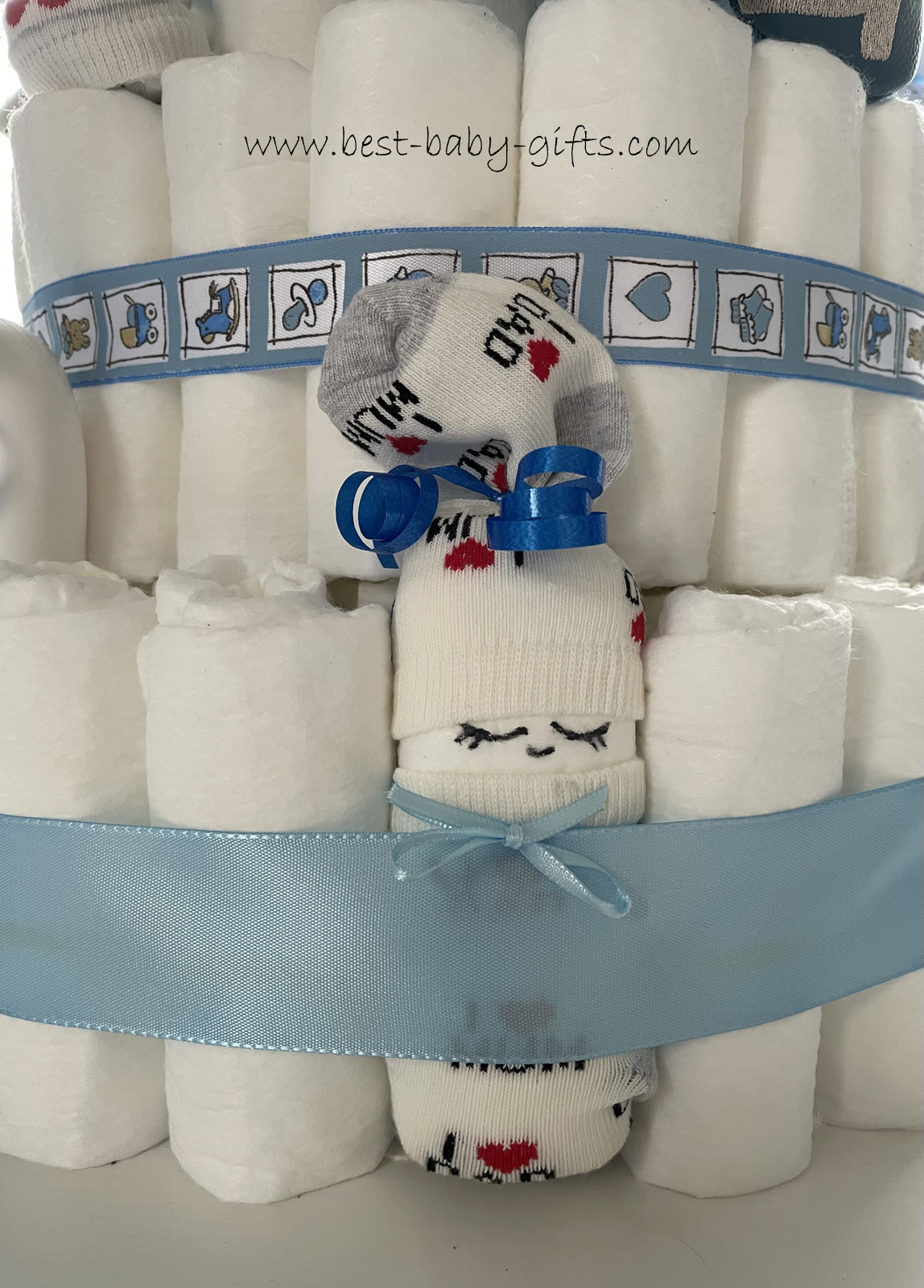 detail of diaper cake with diaper baby, blue ribbon