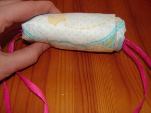 fingers with fully integrated diaper with ribbon inside
