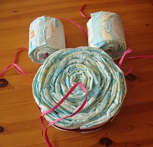 1 large roll of diapers (owls body) and 2 smaller rolls (owl eyes) - ribbons hanging