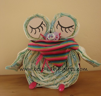 sleeping owl diaper in girly colors with colorful baby scarf