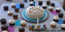 many delicious cupcakes revolve around a birthday cake with 1 candle