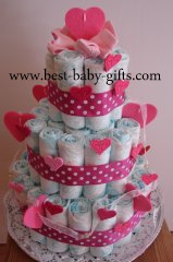 a tree tier diaper cake in pink, decorated with lots of (felt) hearts