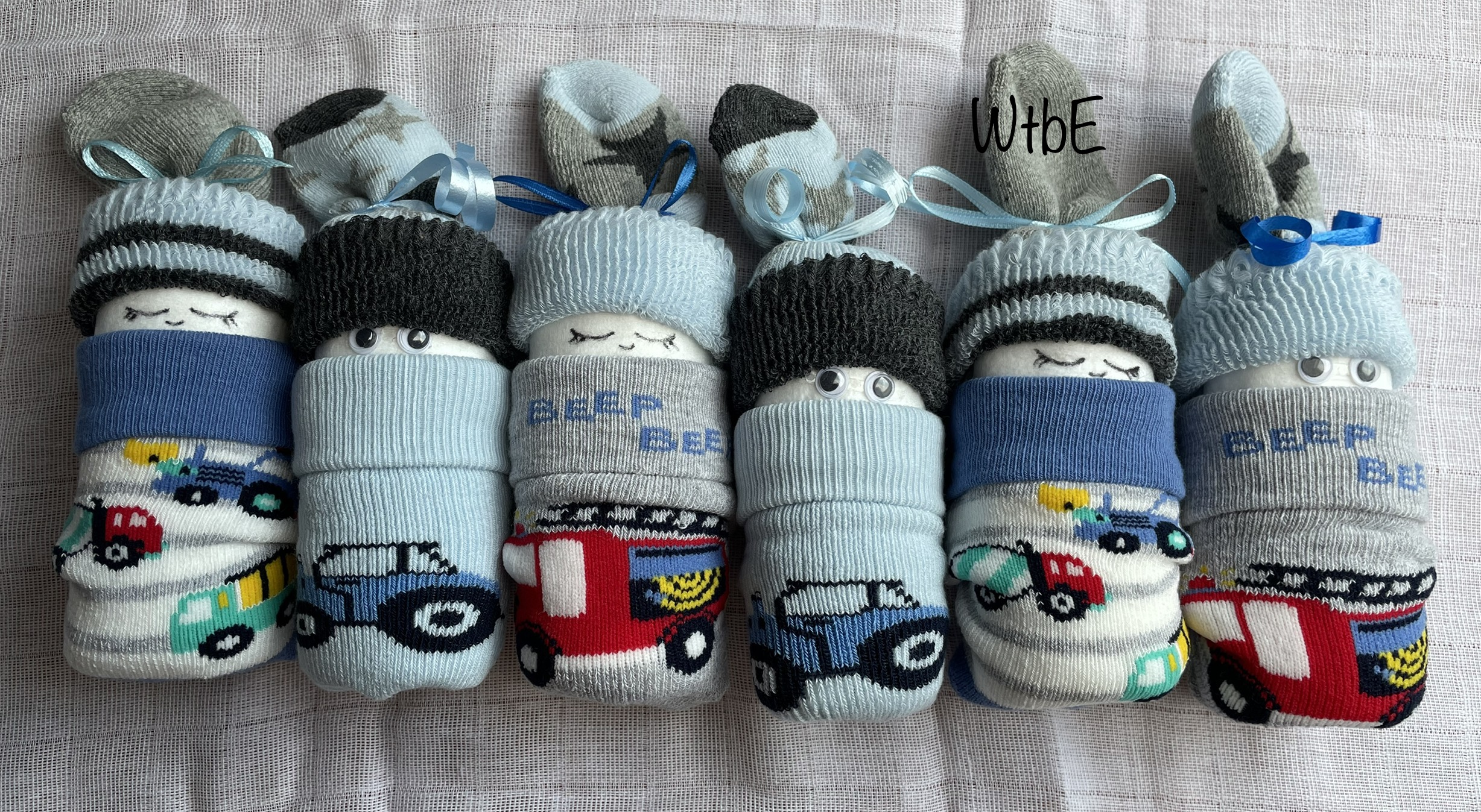 sock diaper babies for boys, 6 diaper babies laid, made of only socks, socks have car designs