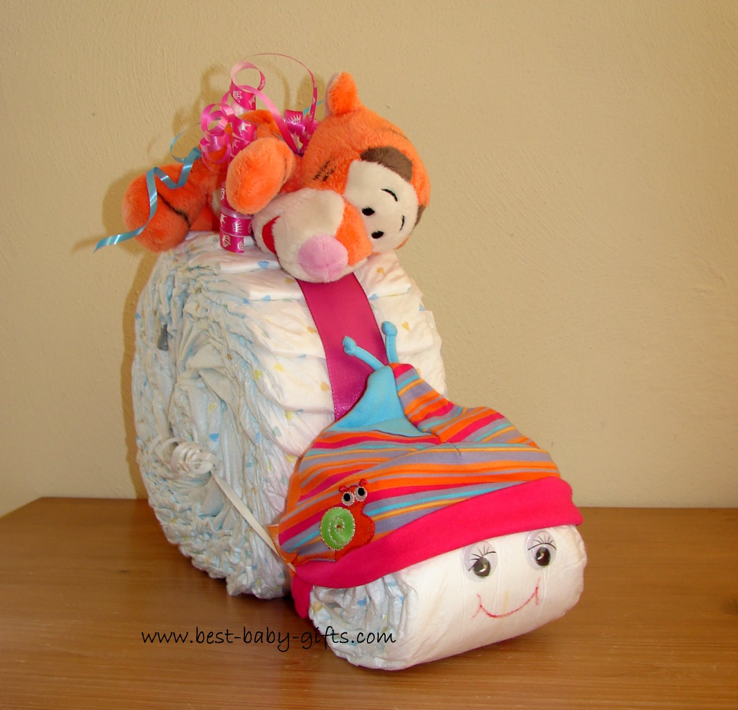 a diaper snail with a plush Tigger on top