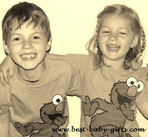 happy boy and girl twin toddlers wearing Elmo shirts