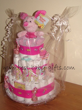 the cake wrapped in clear gift foil wrap with lots of ribbons